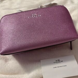 Coach Purple Metallic Cosmetic Bag
A metallic lilac almost